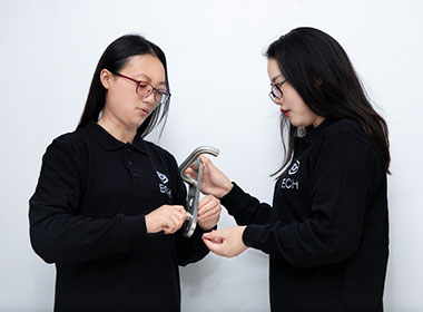 two employees checking products for sampling